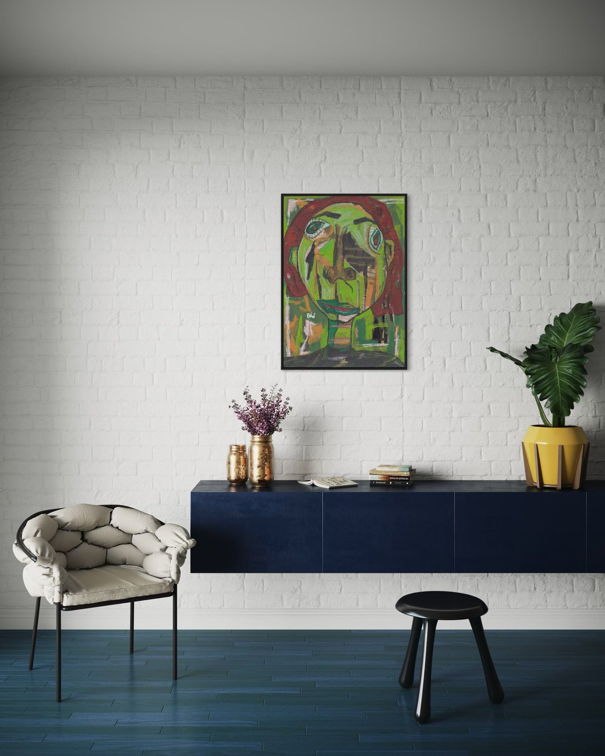 Modern interior with a blue console table, white armchair, and abstract painting on a white brick wall.