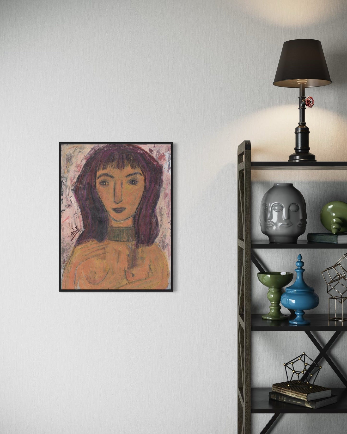 Framed artwork of a woman's portrait on a wall next to a shelf with decorative items.