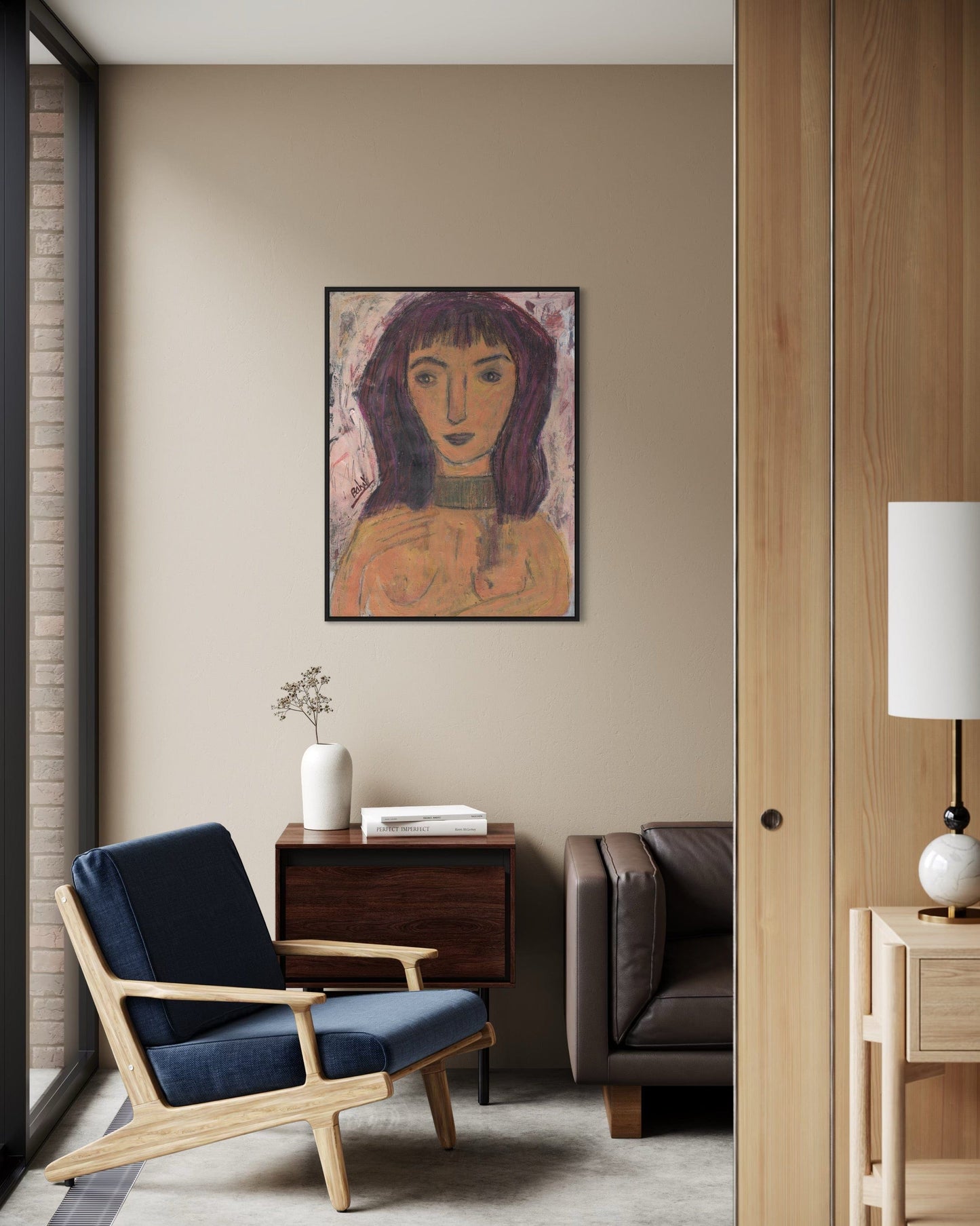 Modern living room with a blue armchair, wooden side table, and abstract painting on the wall.