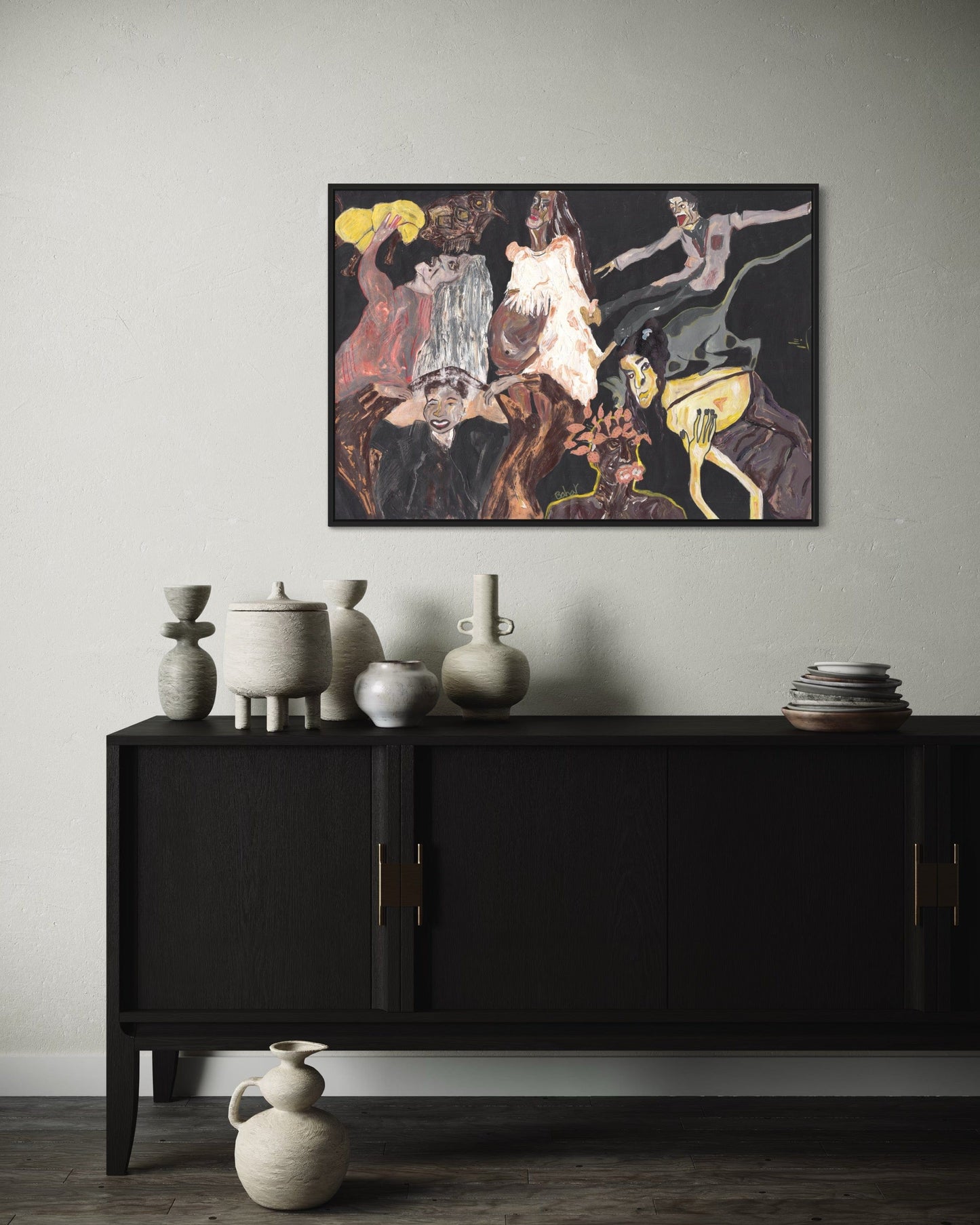 Black cabinet with decorative vases against a wall with a large painting
