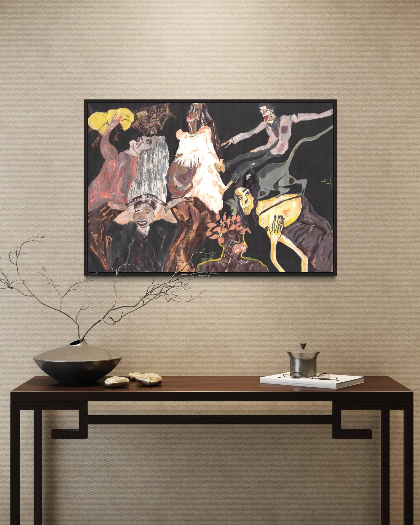 Framed abstract painting on a wall above a console table with decorative items.
