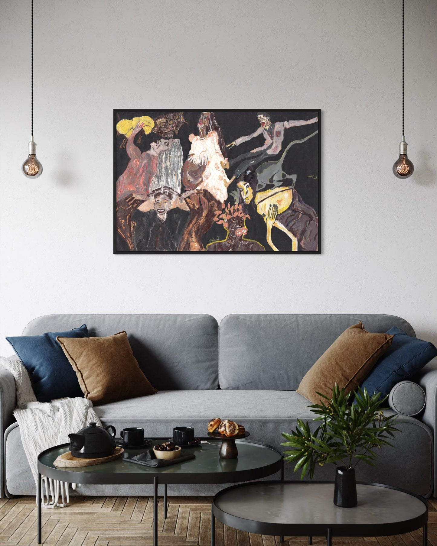 Living room with a gray sofa, round coffee table, and abstract painting on the wall.