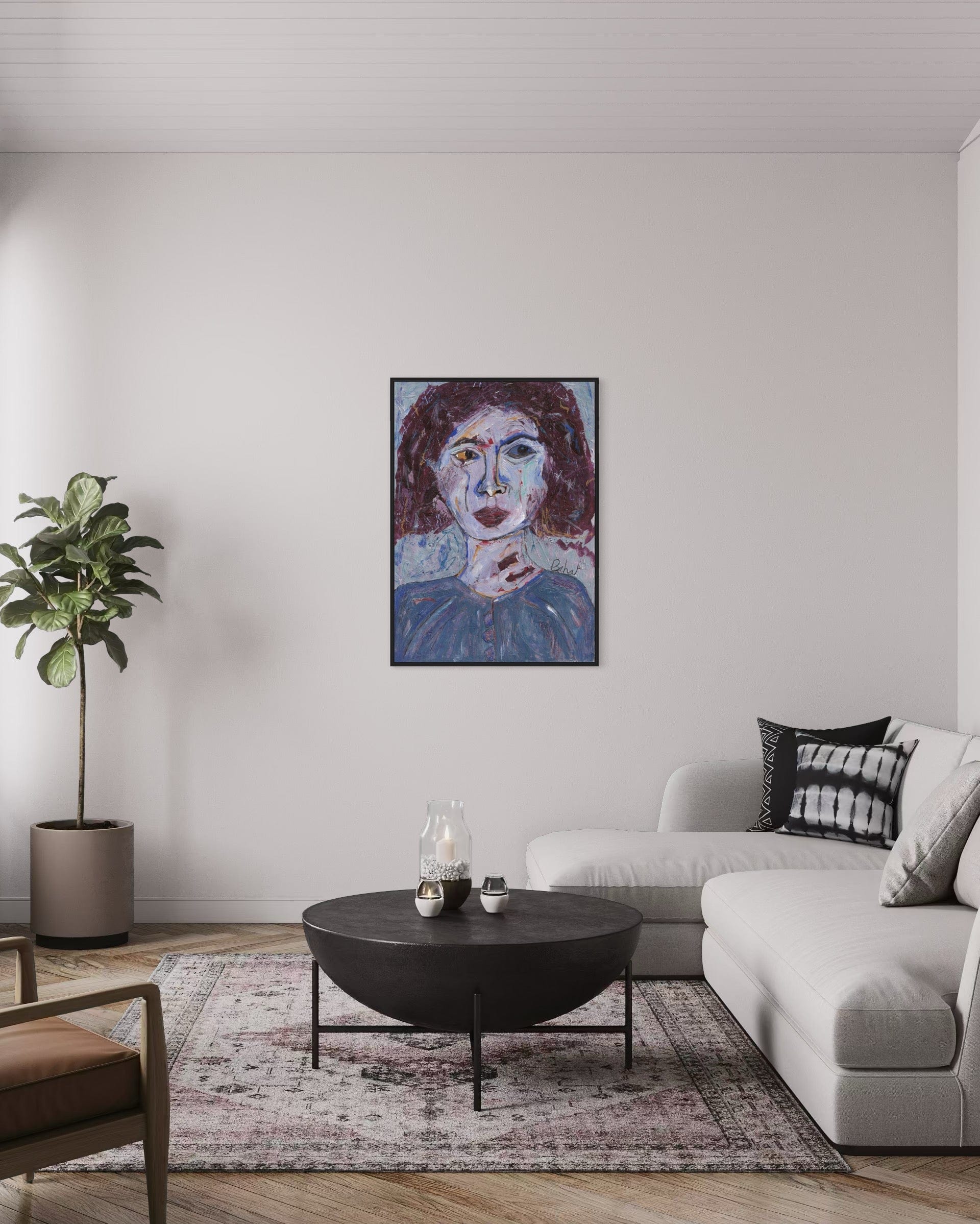 Living room with a modern sofa, coffee table, and artwork on the wall.