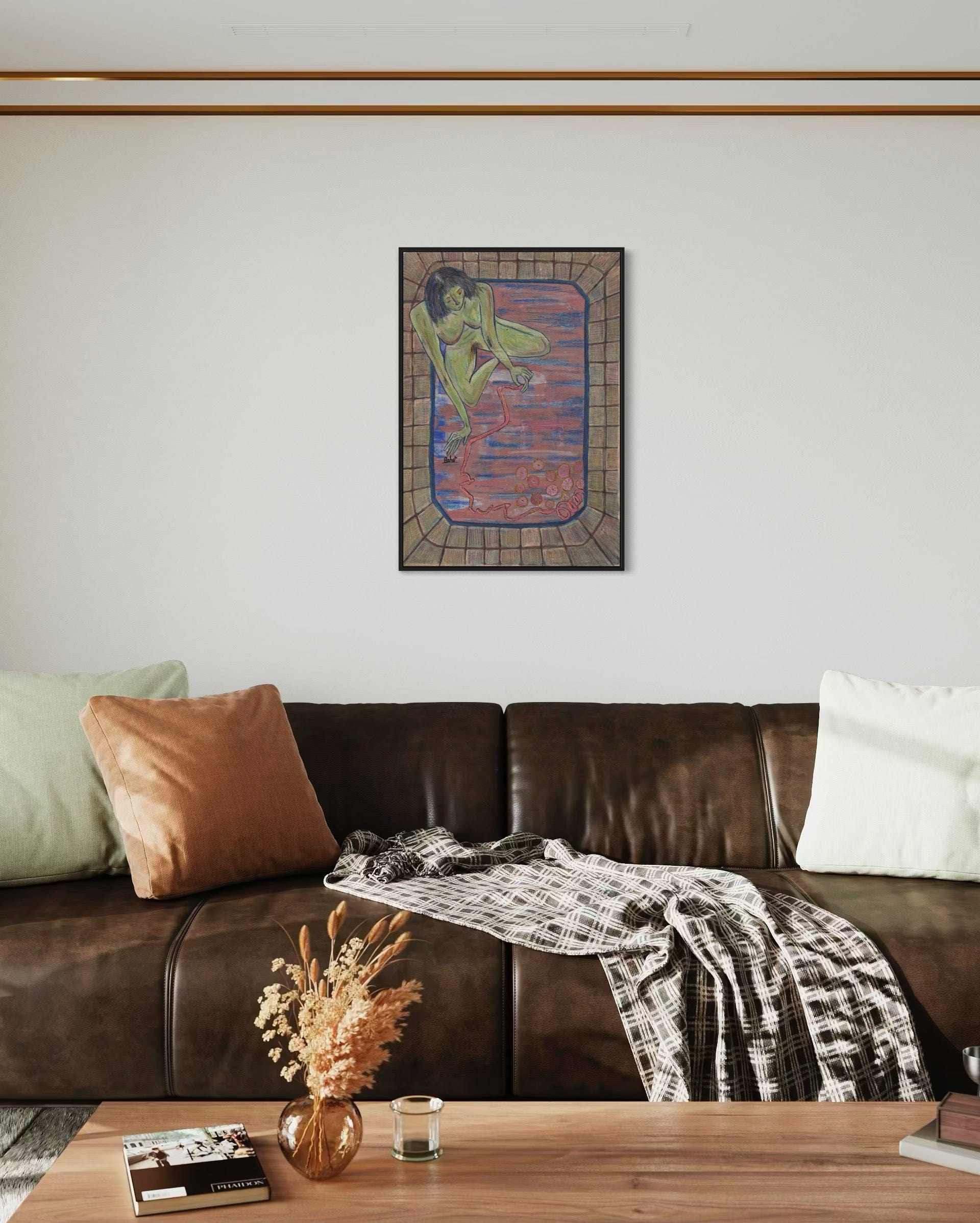 Living room with a brown leather sofa, decorative pillows, a wooden coffee table, and a colorful abstract painting on the wall.