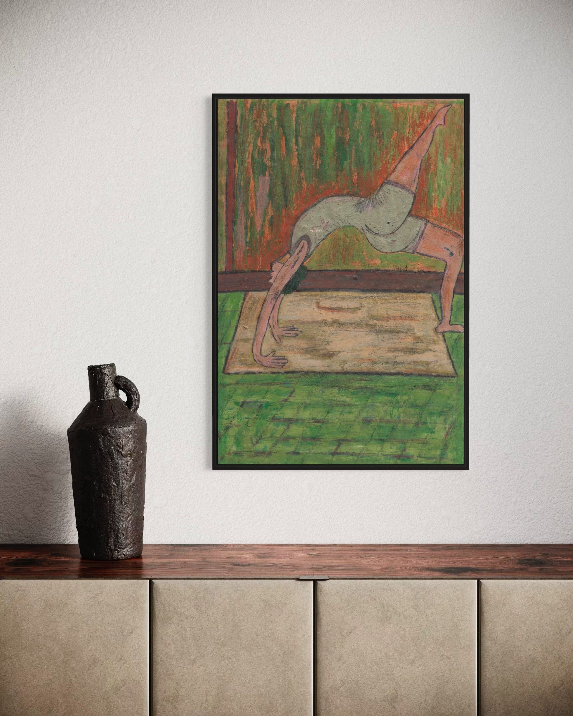 Framed abstract artwork on a wall above a wooden shelf with a vase.