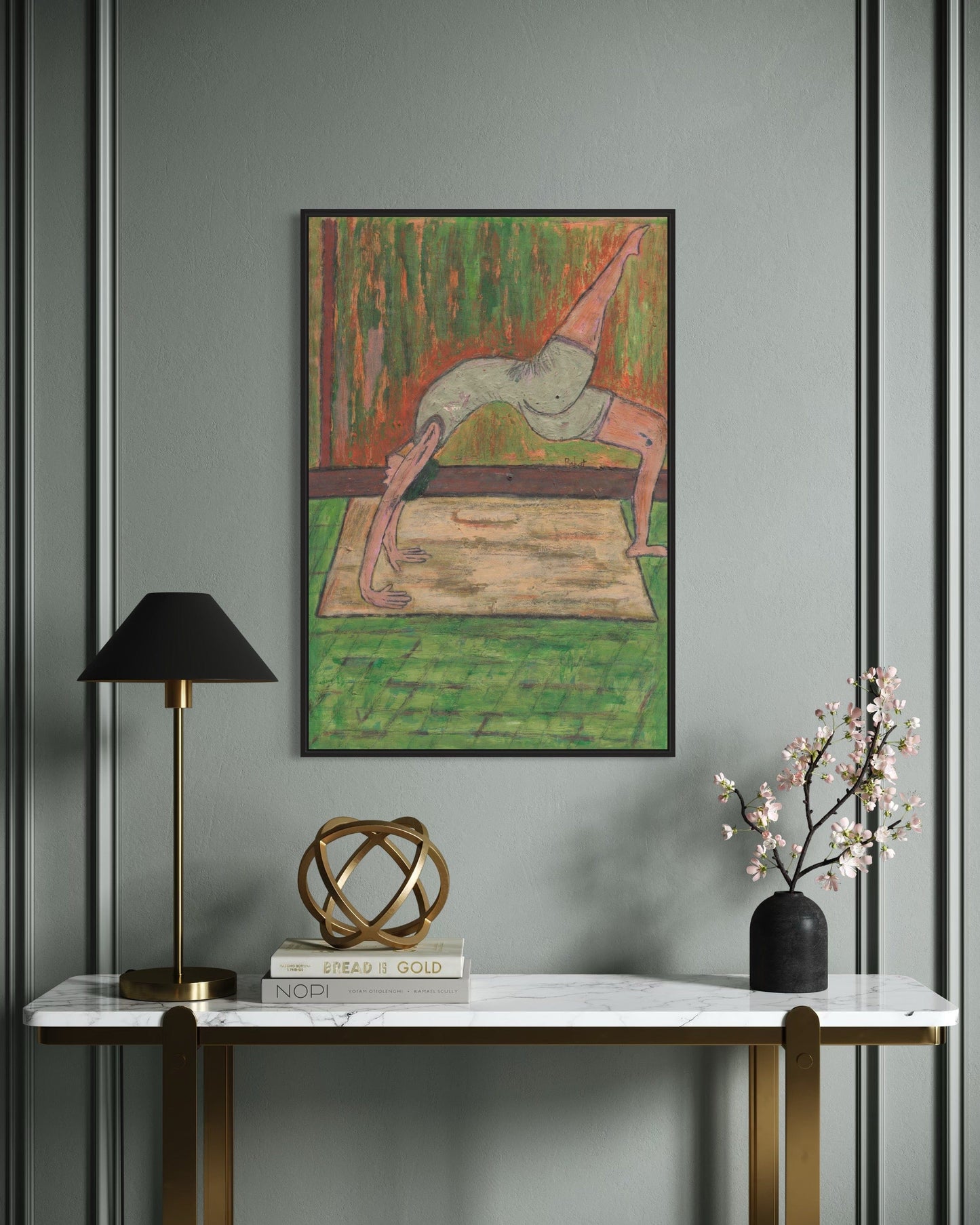 Decorative interior with a painting, lamp, sculpture, and vase on a console table against a gray wall.