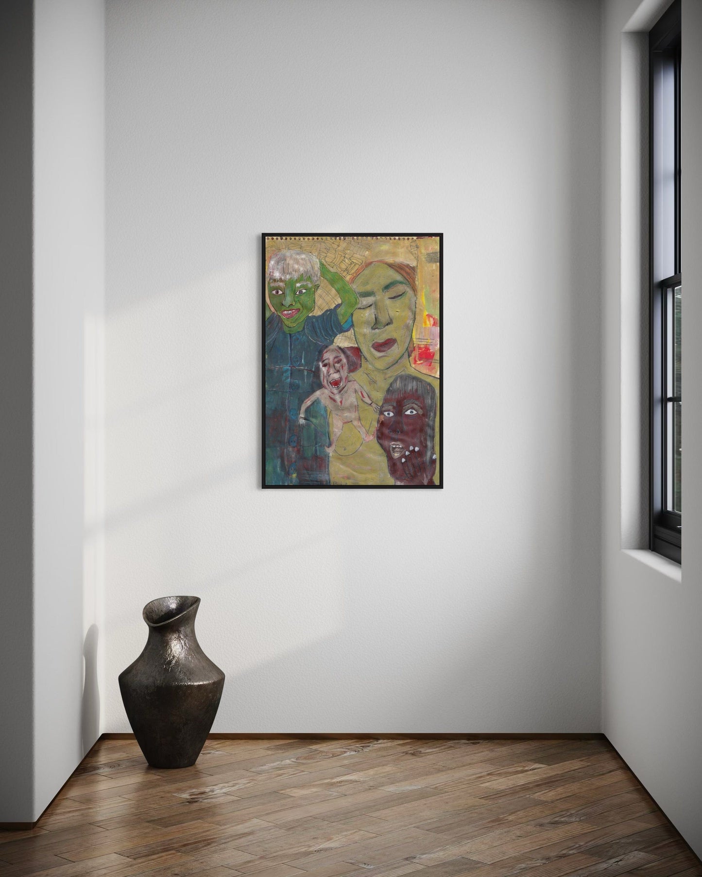 Framed artwork on a wall with a vase on the floor in a room.