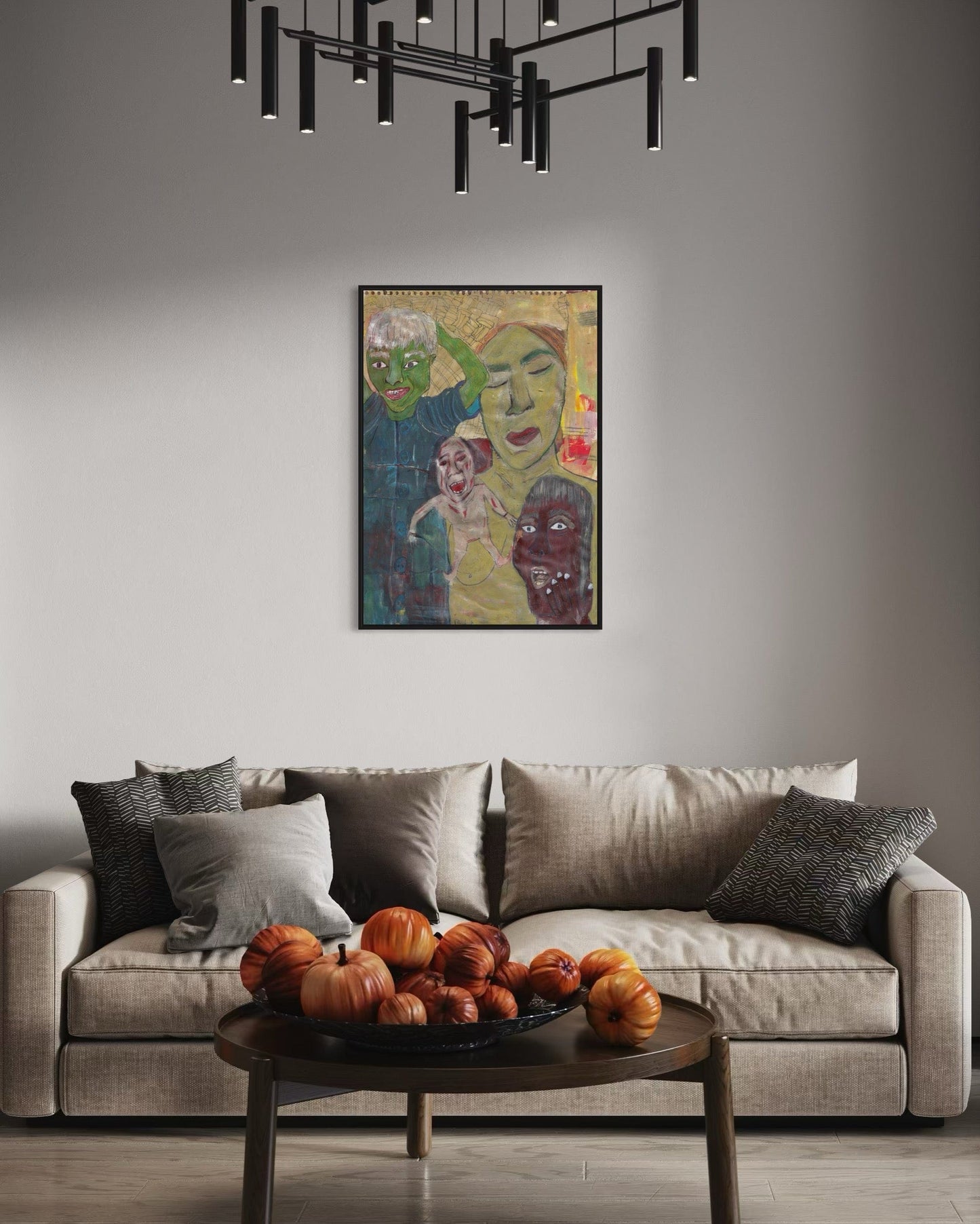 Living room with a gray sofa, decorative pillows, a coffee table with pumpkins, and a colorful abstract painting on the wall.