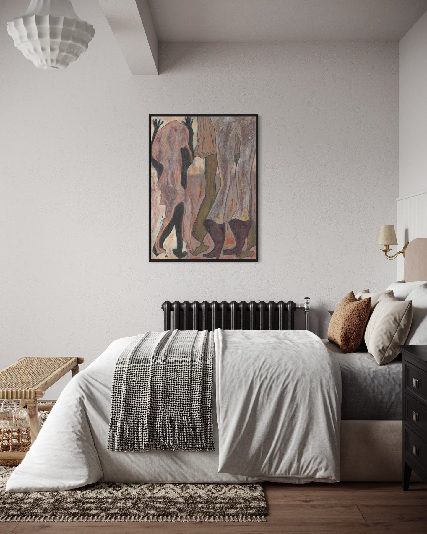 Modern bedroom with a bed, artwork on the wall, and decorative items.