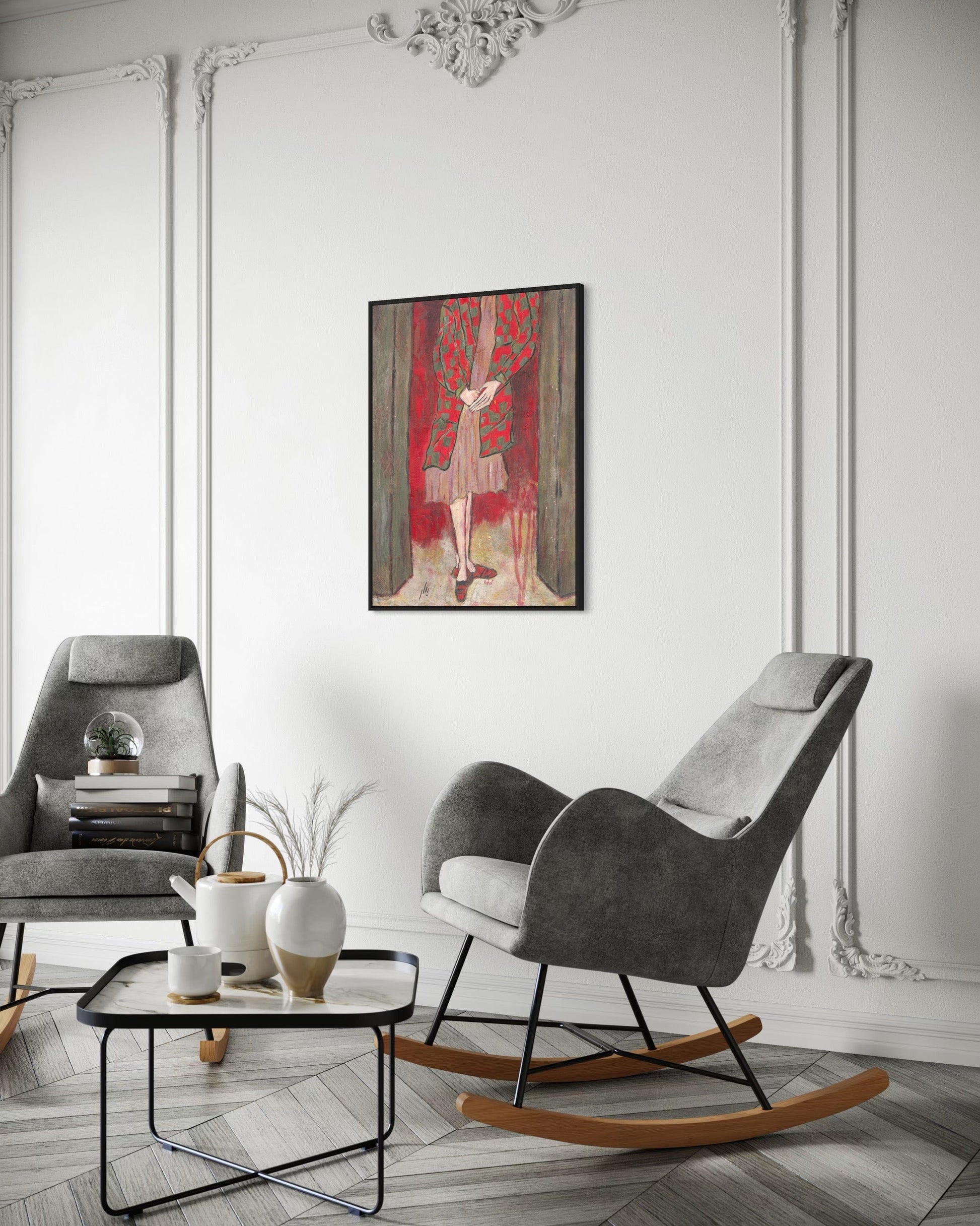 Living room with gray armchair, rocking chair, and decorative painting on the wall.