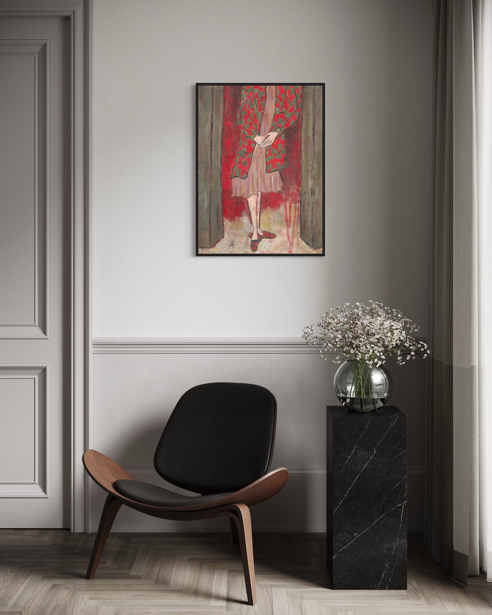 Modern interior with a black chair, side table, and abstract painting on a gray wall.