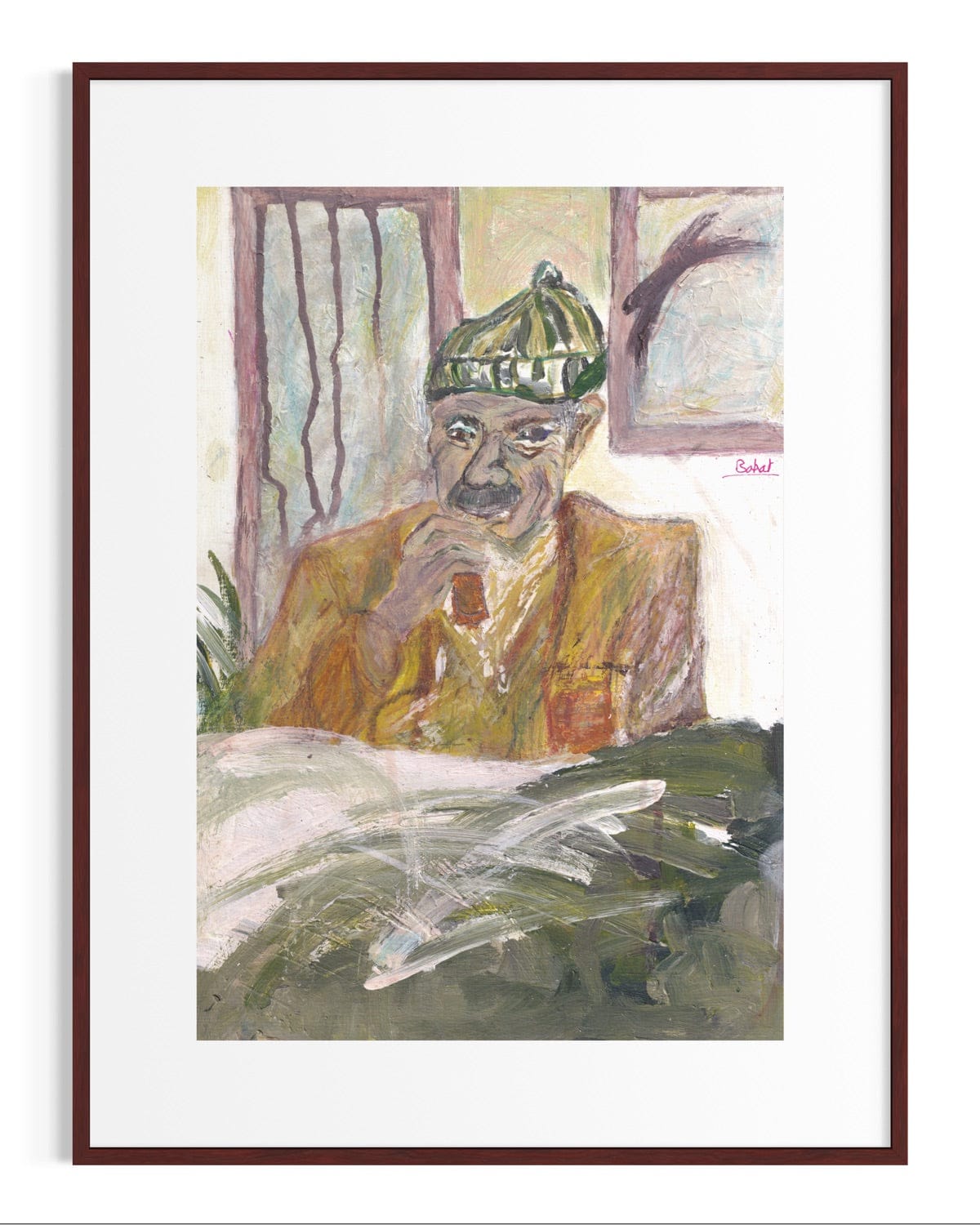 Framed artwork of a man wearing a green cap and sitting at a desk.