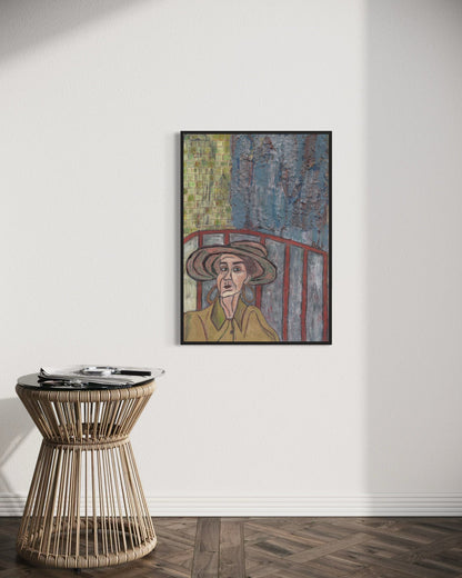 Framed artwork on a wall above a wicker side table.