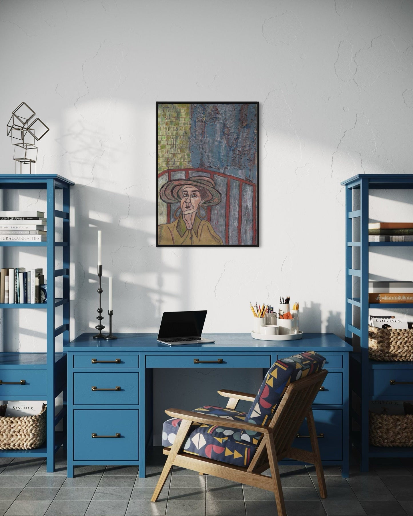 Home office with blue desk, chair, and bookshelves, featuring a painting on the wall.