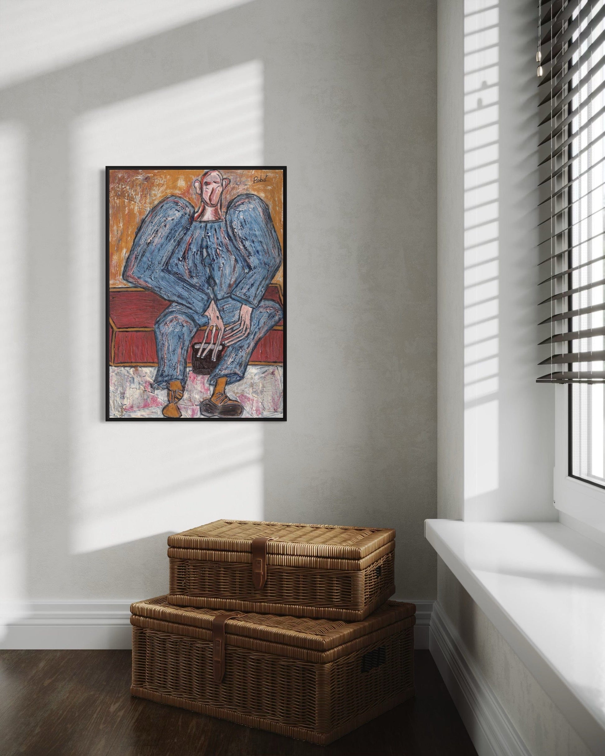 Framed artwork of a blue figure on a wall above two wicker baskets.