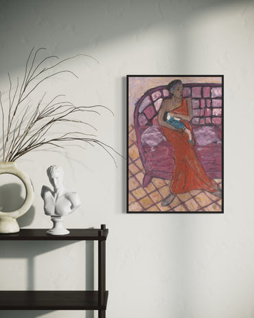 Framed artwork of a woman in an orange dress on a wall above a shelf with decorative items.