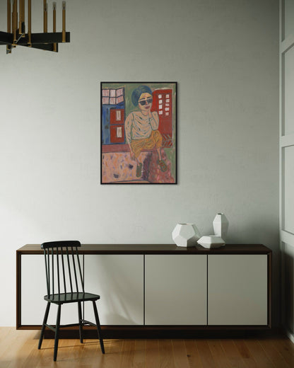 Modern interior with a colorful painting on the wall, a black chair, and a wooden sideboard.