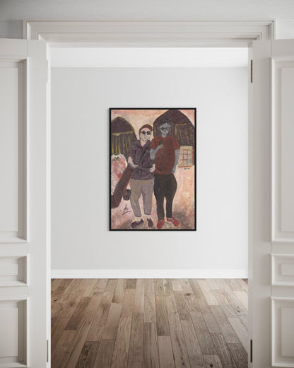Framed artwork of two people standing together on a wall in a room with wooden flooring.