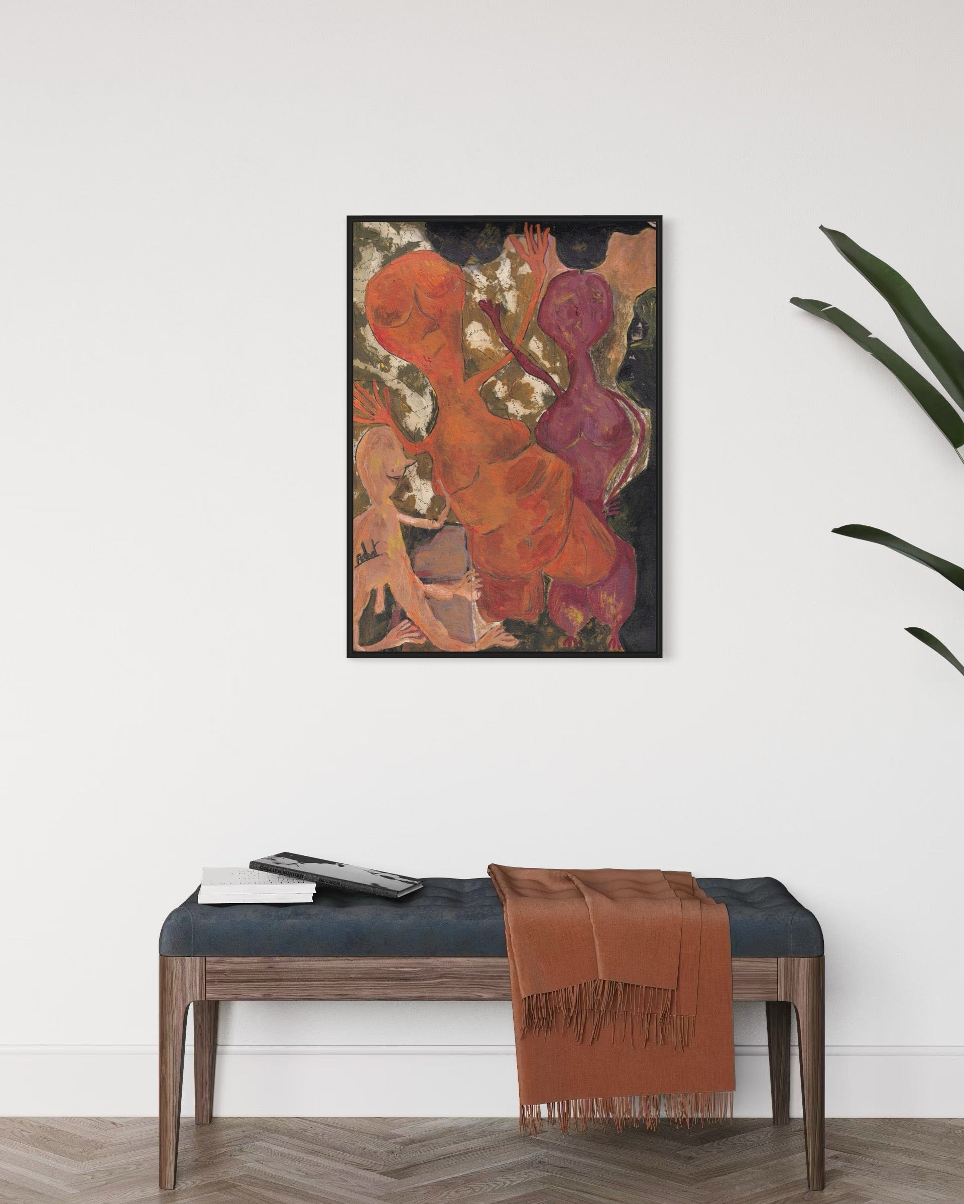Abstract painting on a wall above a bench with a brown blanket