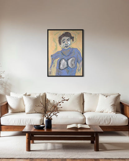 Framed artwork above a white sofa in a living room