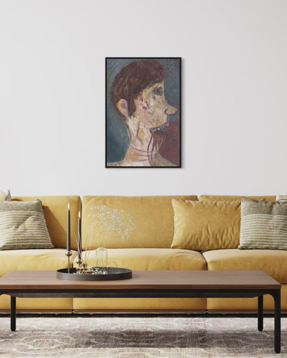 Framed artwork above a yellow sofa in a living room setting