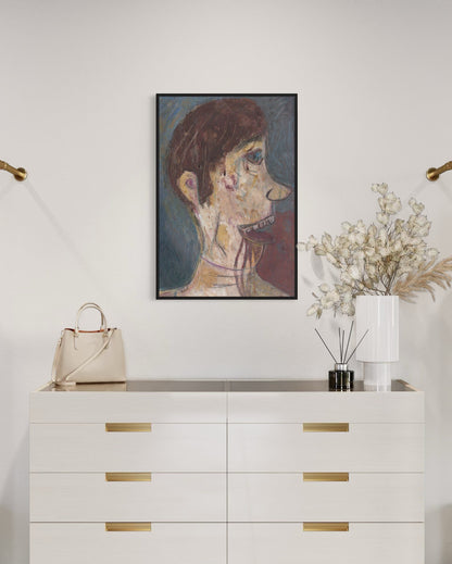 White dresser with gold handles, beige handbag, framed artwork, and decorative plants on a white wall.