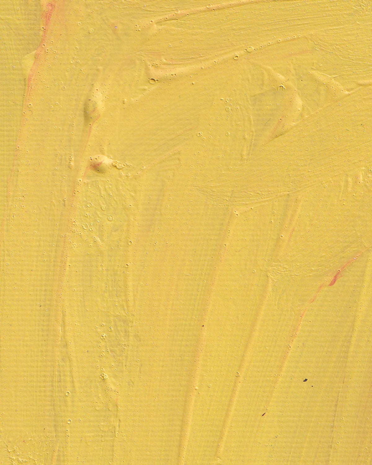 Textured yellow surface with brush strokes