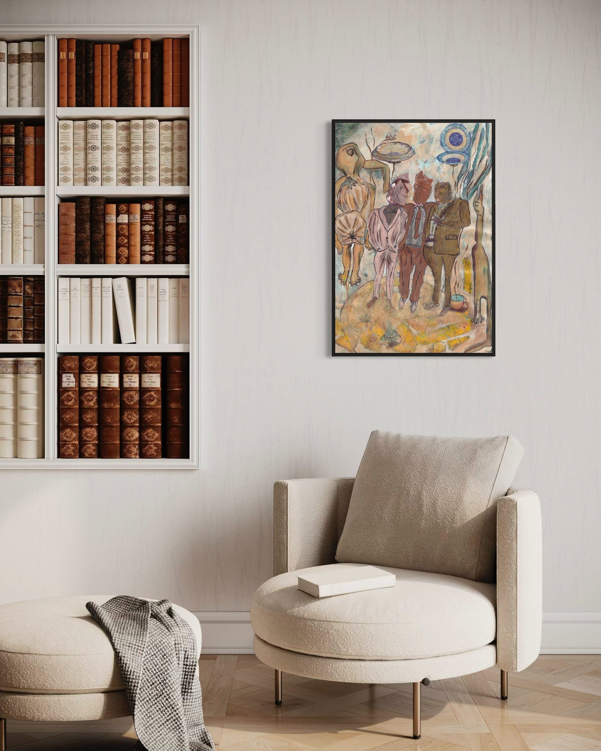 Beige armchair with a bookshelf and wall art in a room setting
