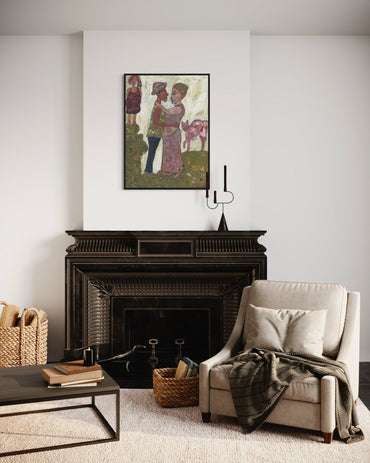 Living room with a fireplace, armchair, and artwork on the wall.