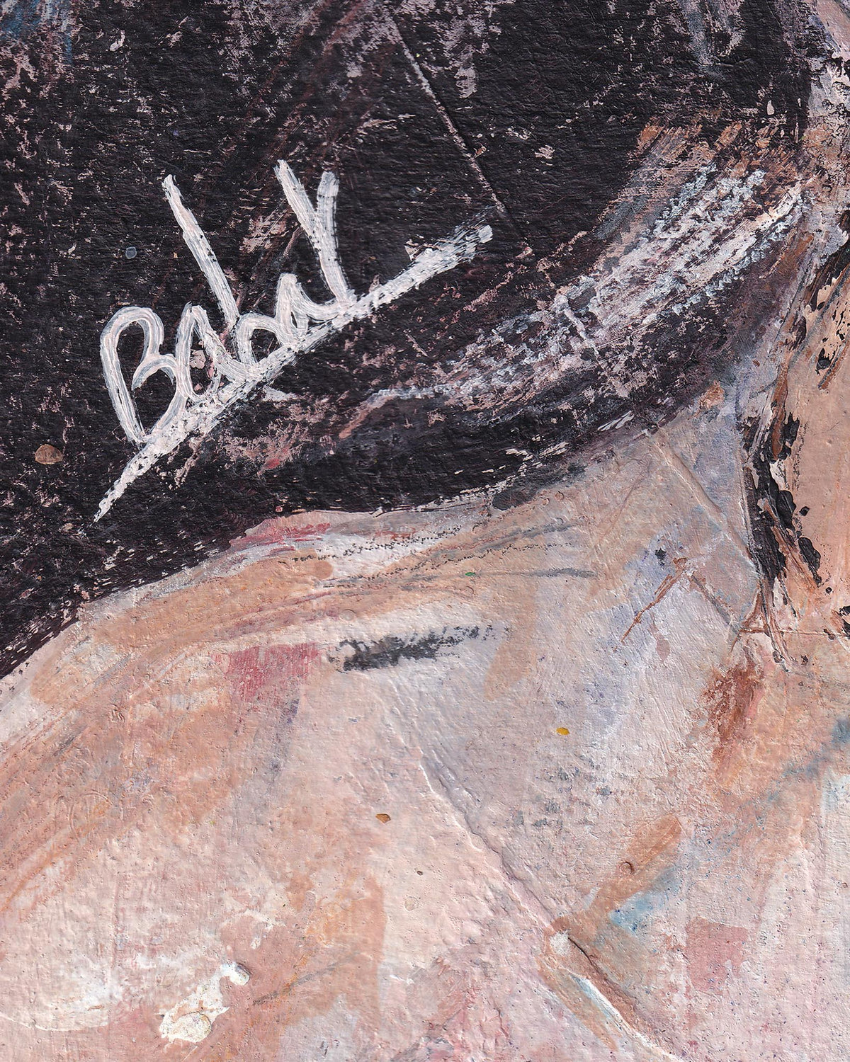 Signature on a textured surface with artistic brush strokes