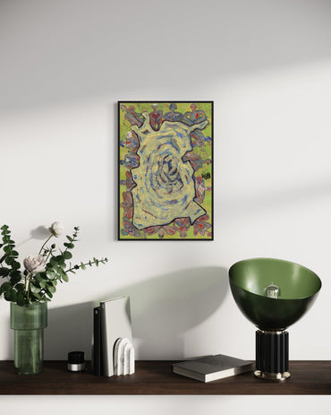 Framed abstract artwork on a wall above a wooden surface with decorative items.