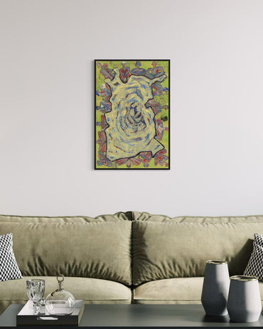 Framed abstract painting on a wall above a sofa