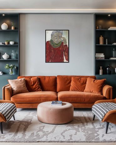 Modern living room with orange sofa, ottoman, and wall art