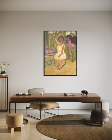 Framed artwork of a woman with flowers in a room with a wooden desk and chairs.