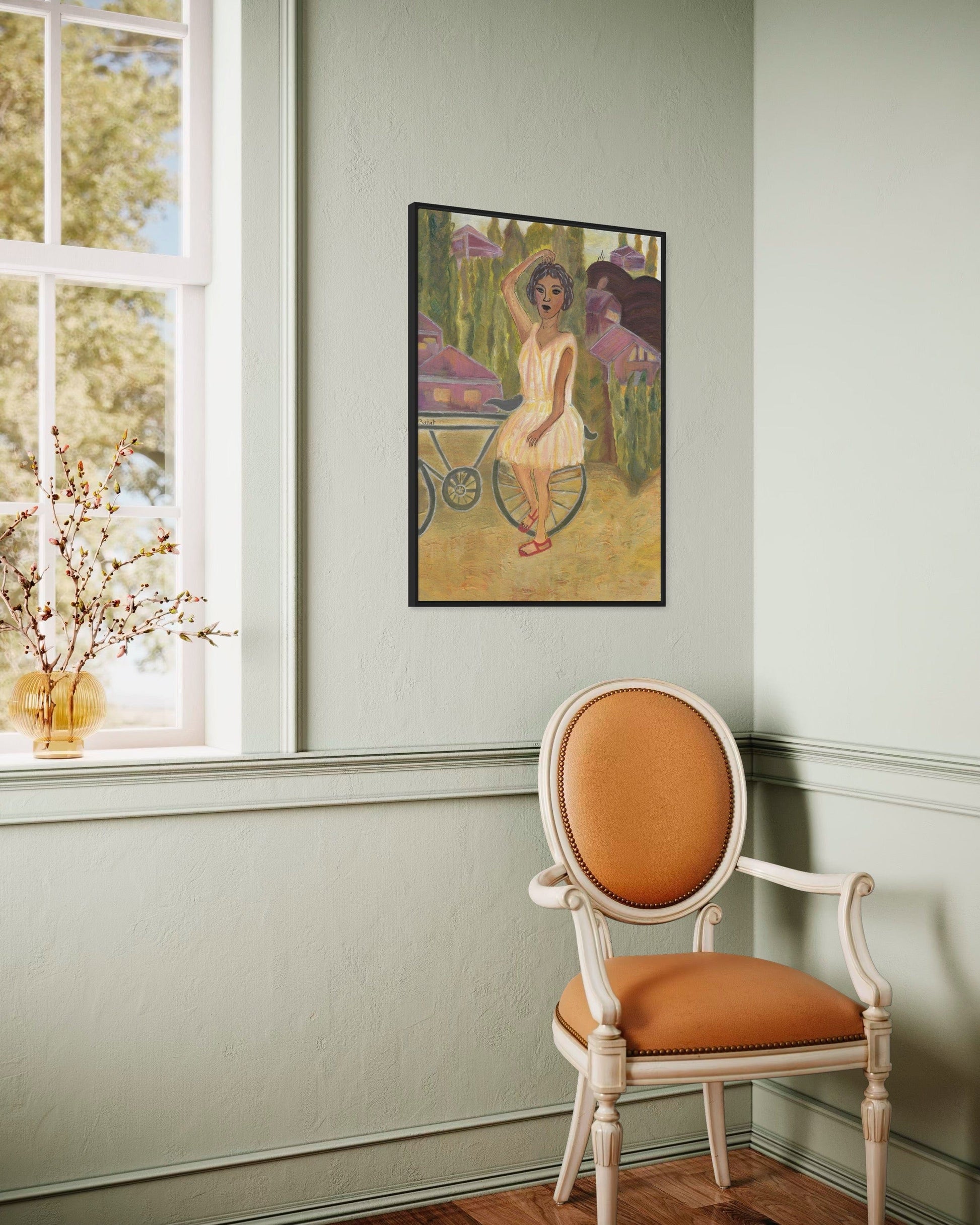 Room interior with a chair, framed artwork on the wall, and a window.