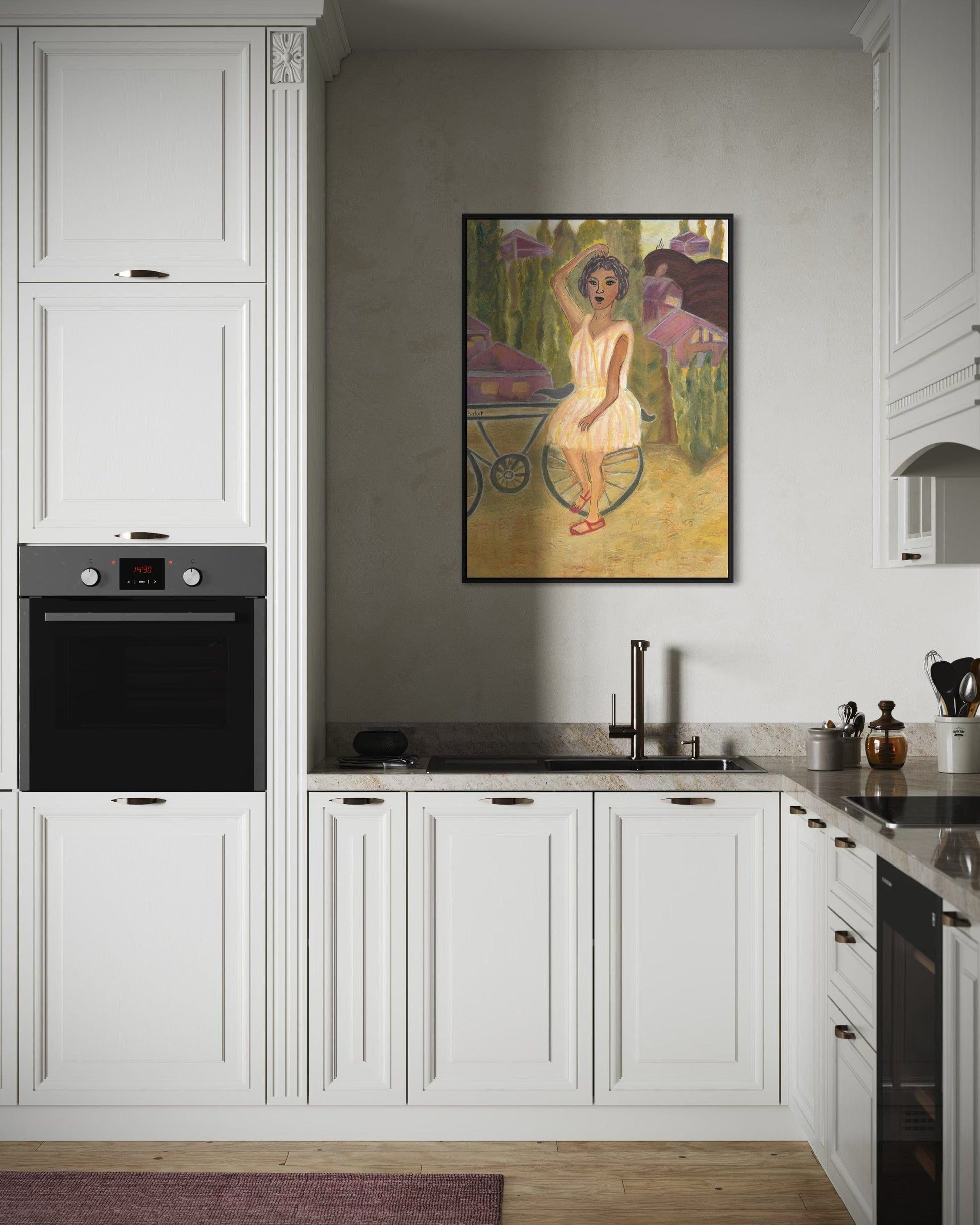 Modern kitchen with white cabinets, black appliances, and a framed painting on the wall.