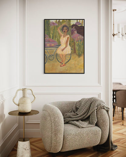 Living room with a textured armchair, small table, and framed artwork on the wall.