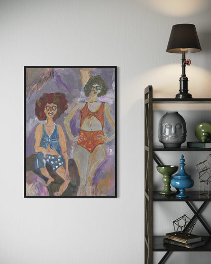 Framed artwork of two women in swimsuits on a wall next to a shelf with decorative items.