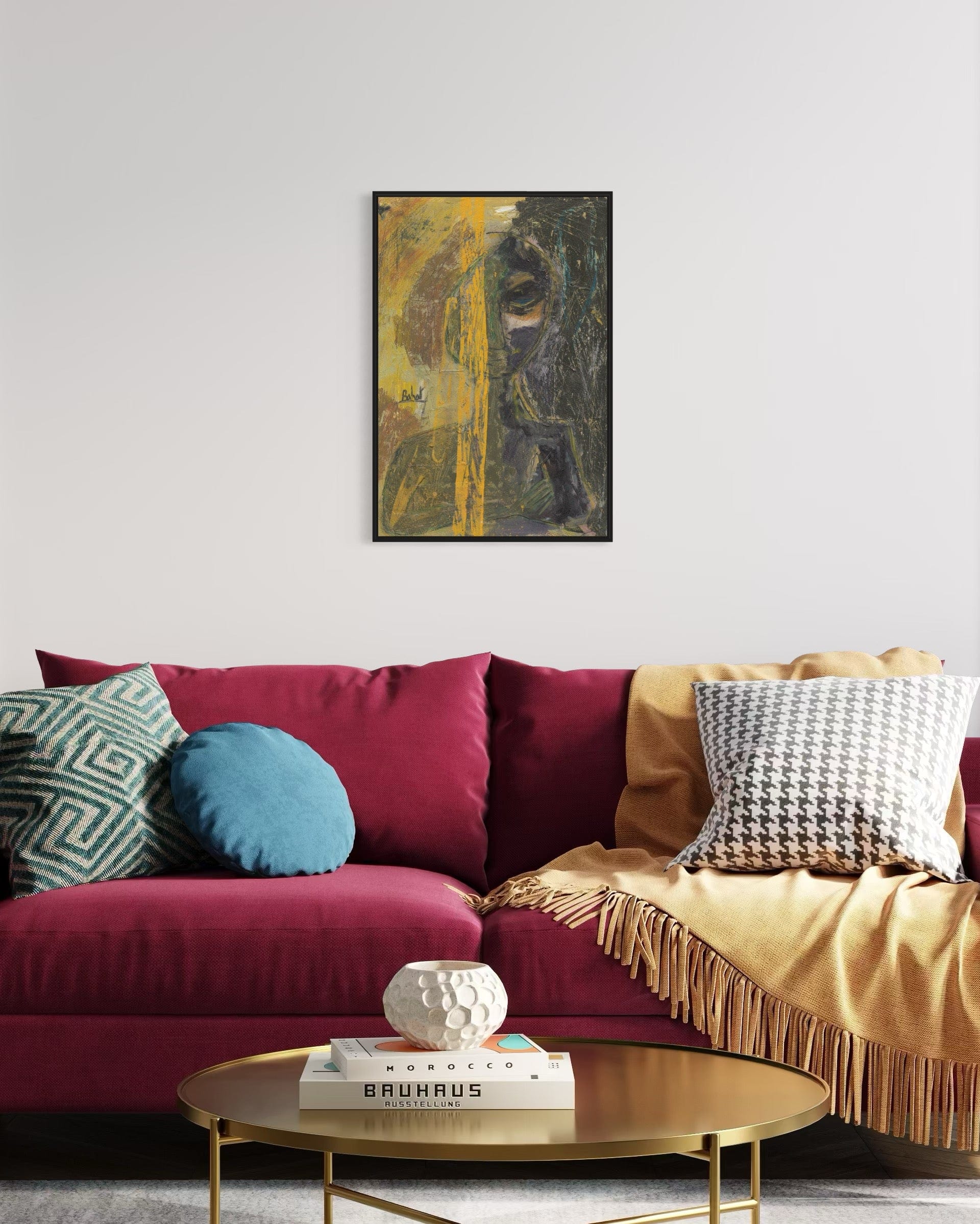 Living room with a colorful sofa, coffee table, and framed artwork on the wall.