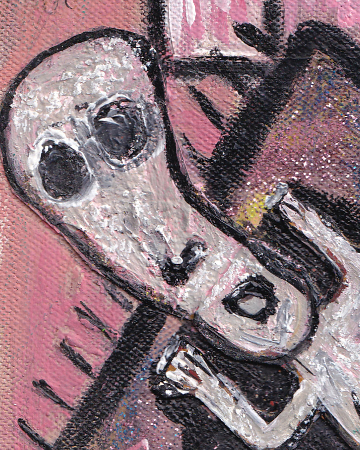 Close-up of a mechanical object with a pink background