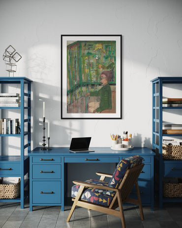 Home office with blue desk, chair, and bookshelves with a framed painting on the wall.