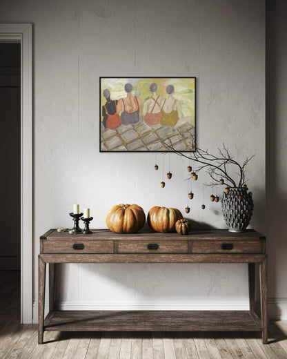 Wooden console table with pumpkins, candles, and a vase against a wall with a framed painting.