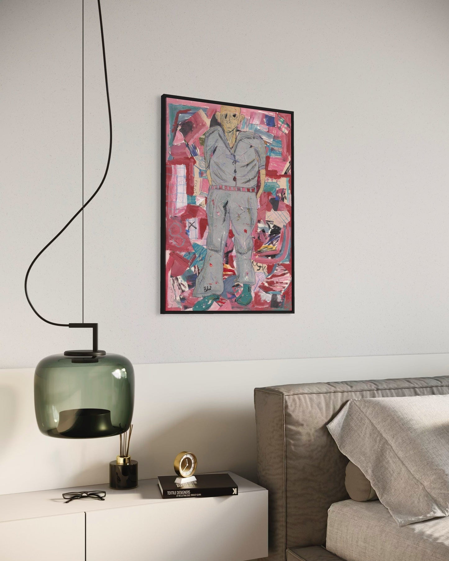 Modern interior with a colorful abstract painting on the wall, a green pendant light, and a white cabinet.
