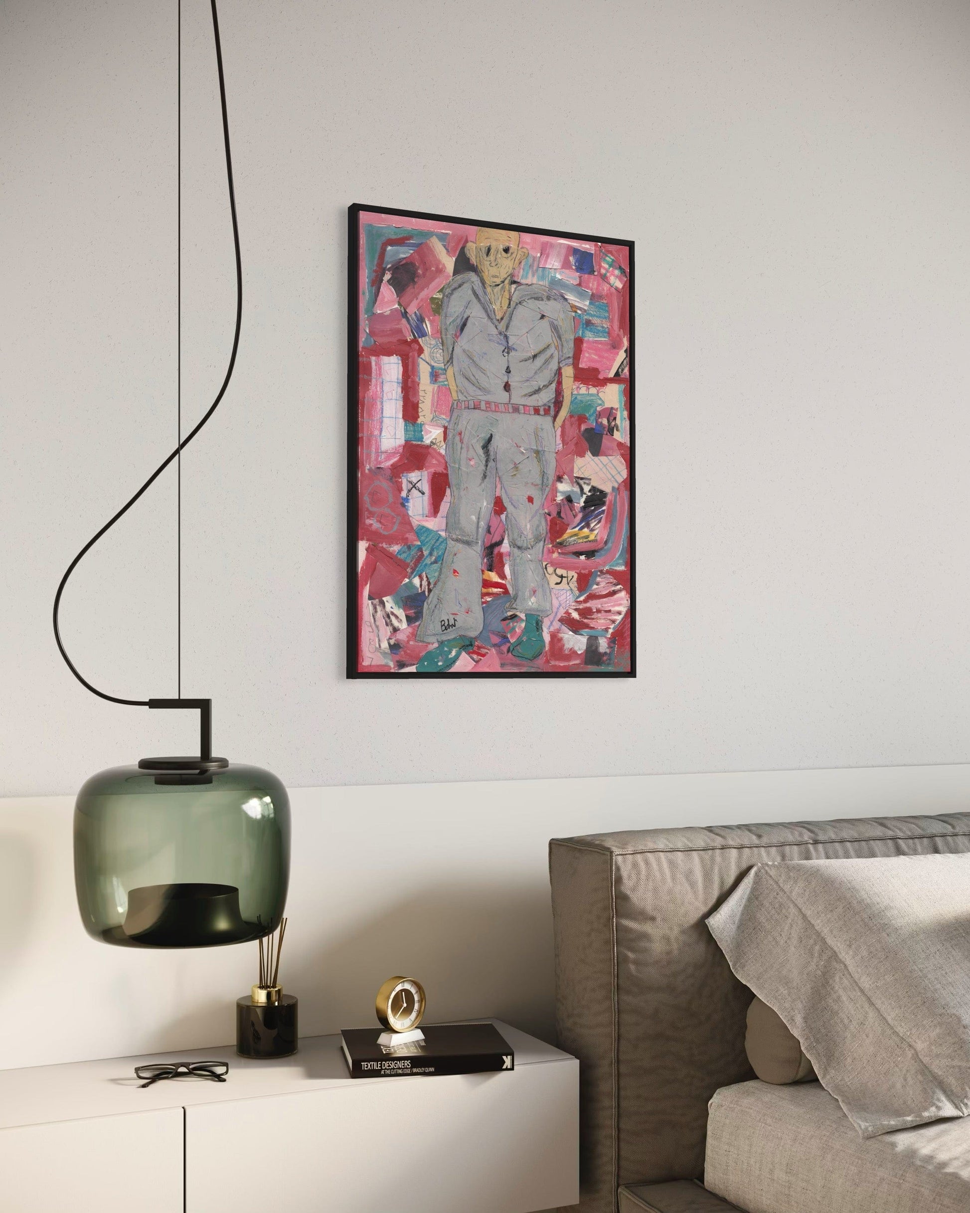 Modern interior with a colorful abstract painting on the wall, a green pendant light, and a white cabinet.