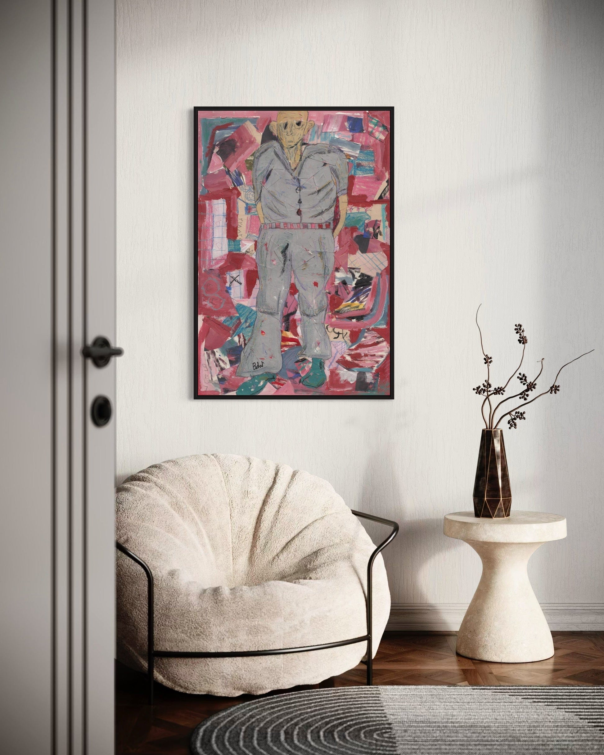 Modern interior with a textured chair, abstract painting, and small table with a vase.