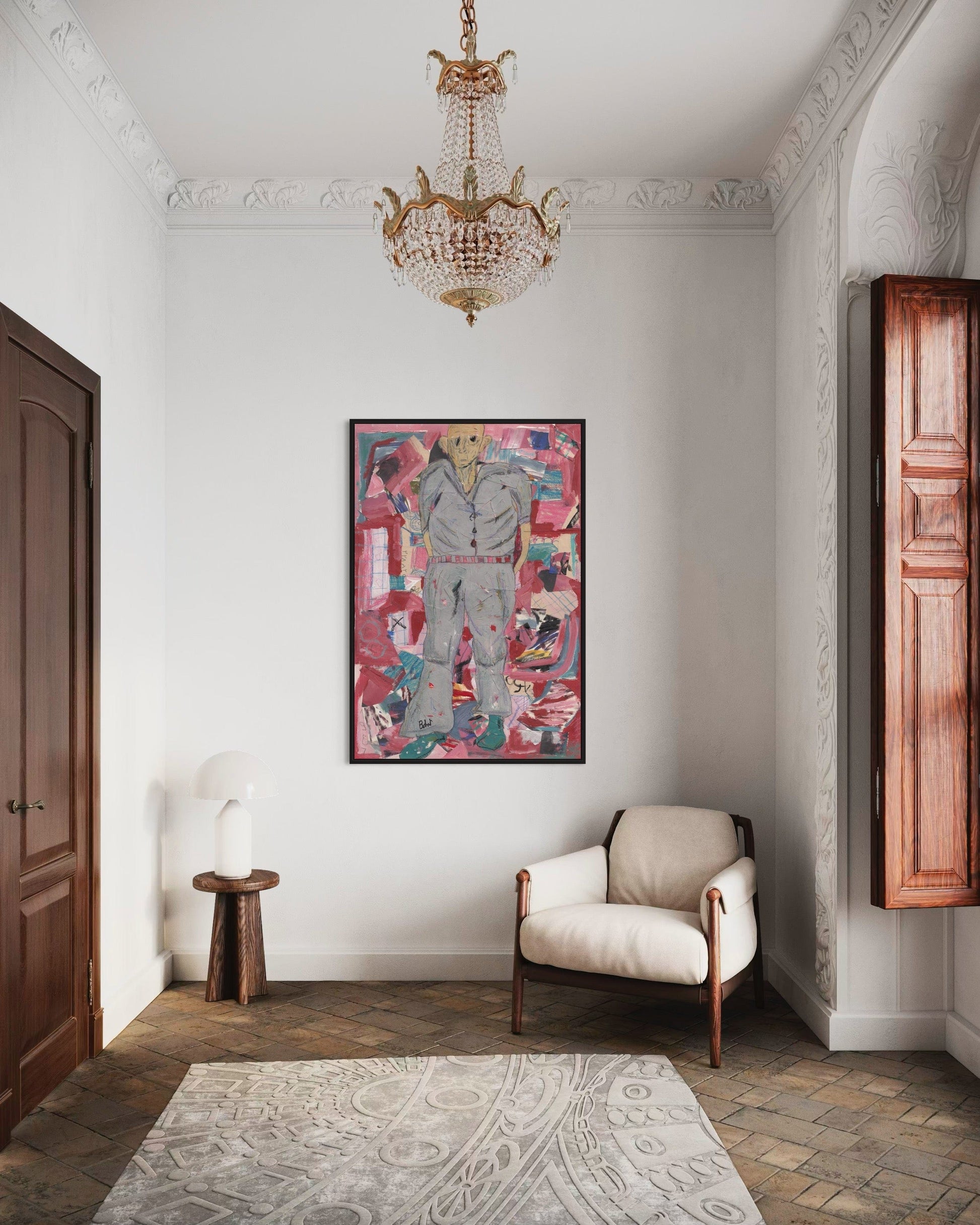 Decorative interior with a colorful painting, beige armchair, and wooden cabinet.