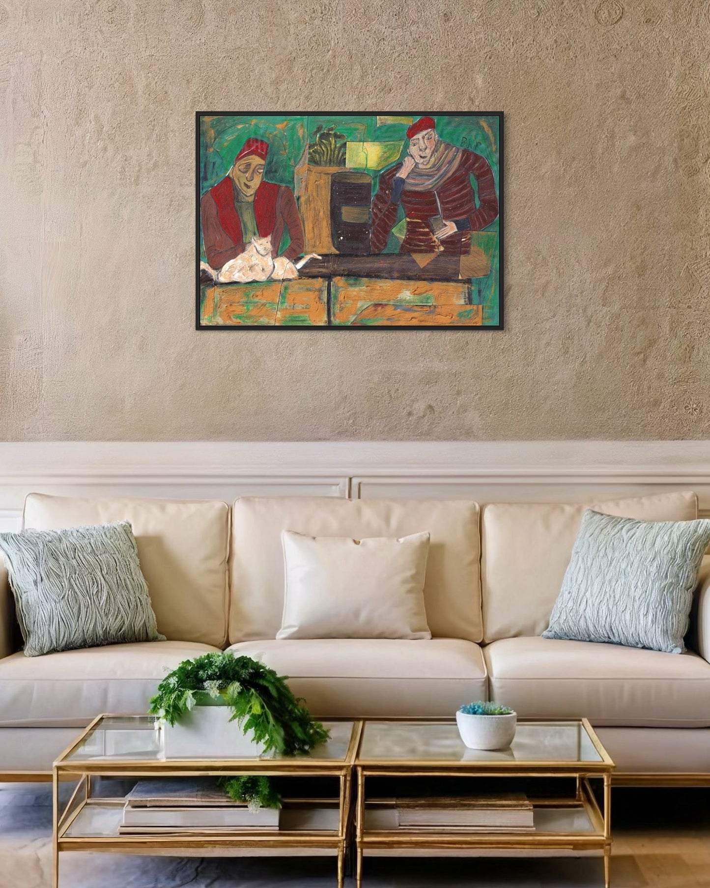 Living room with a beige sofa, decorative pillows, and a painting on the wall.