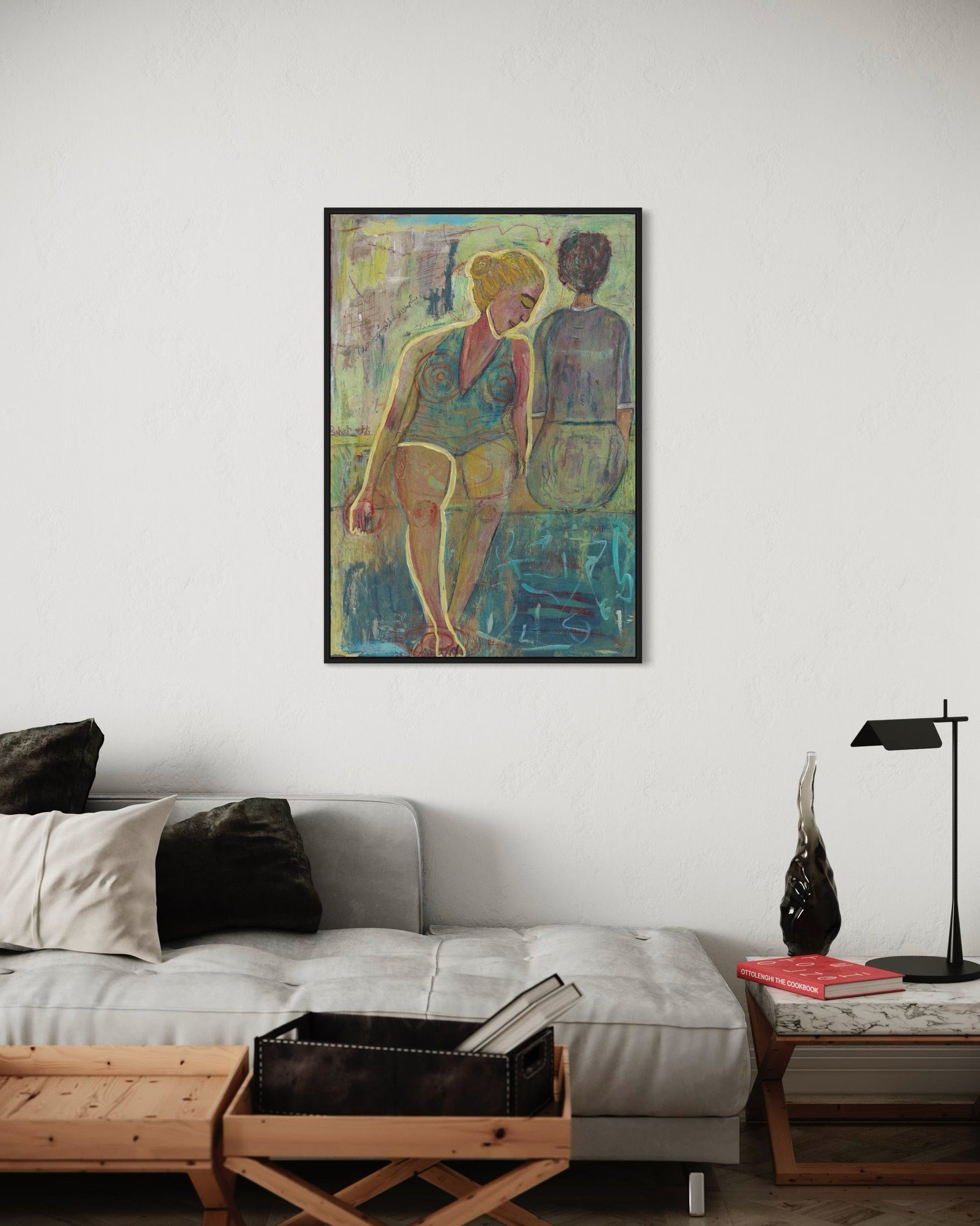 Living room with a sofa, coffee table, and a colorful painting on the wall.
