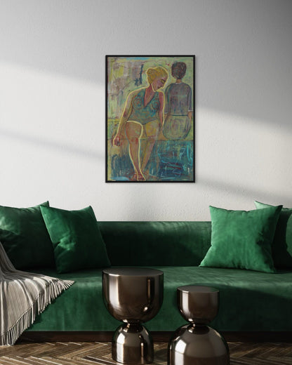 Green sofa with decorative pillows and a framed artwork on the wall in a living room setting.