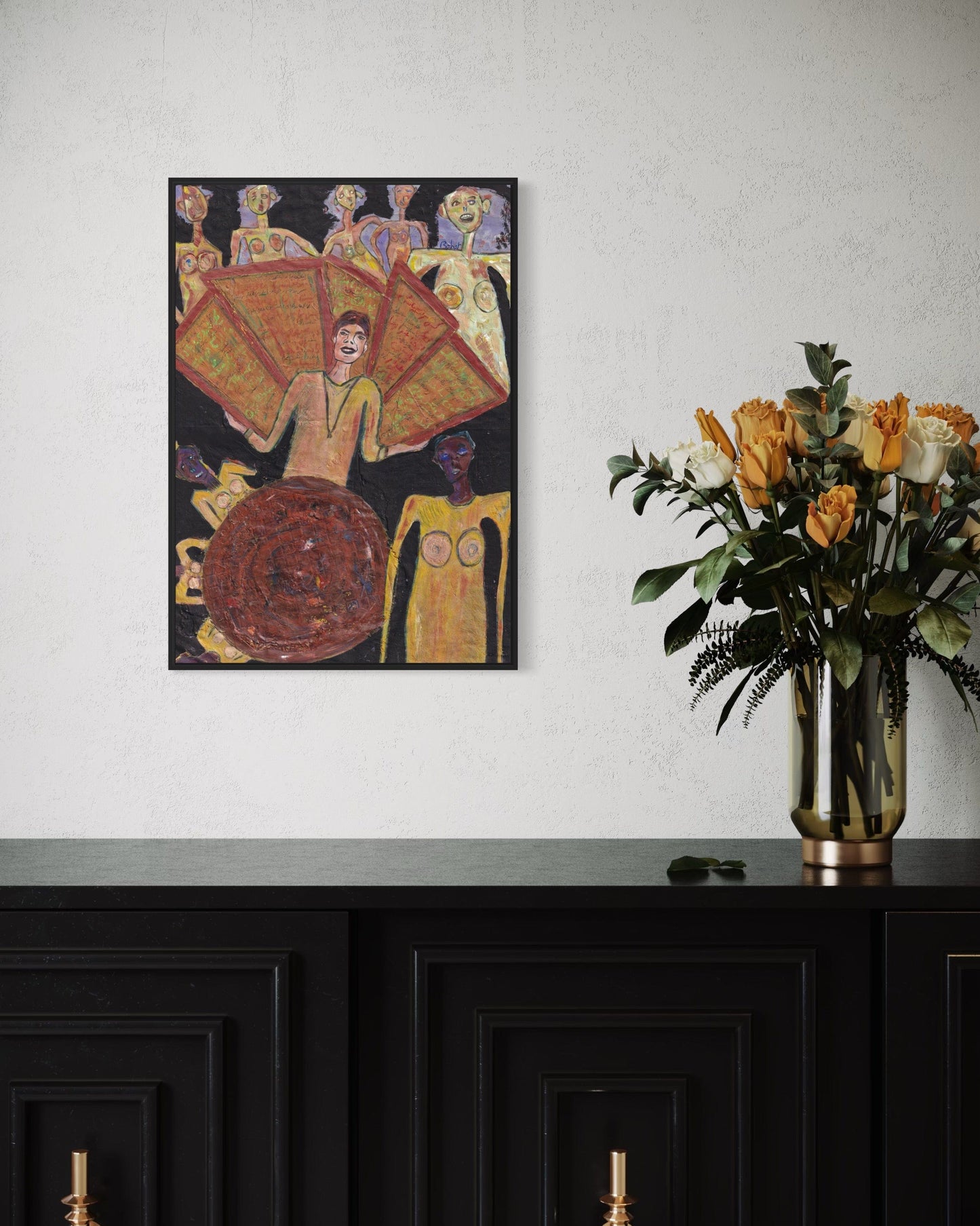 Framed artwork on a wall above a dark cabinet with a vase of flowers.